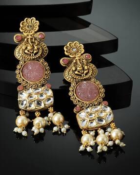 women gold-plated kundan & pearl dangler earrings