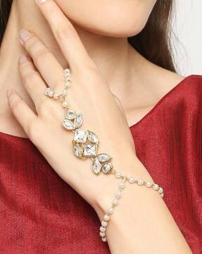 women gold-plated kundan-studded bracelet