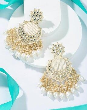 women gold-plated kundan-studded earrings