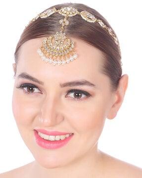 women gold-plated kundan studded mang tika