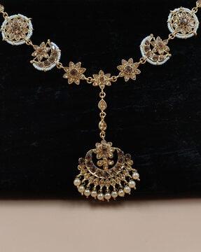 women gold-plated kundan studded mang tika