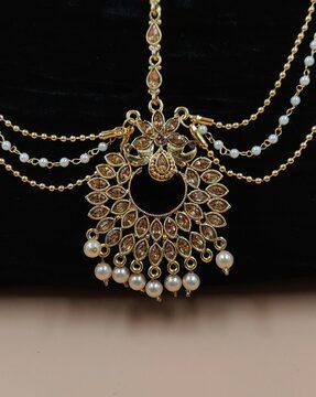 women gold-plated kundan-studded mang tikka