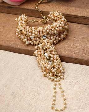 women gold-plated pearl & kundan-studded hathphool
