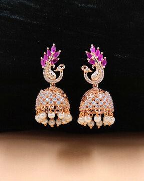 women gold-plated stone-studded jhumkas