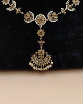 women gold-plated stone-studded maangtikka