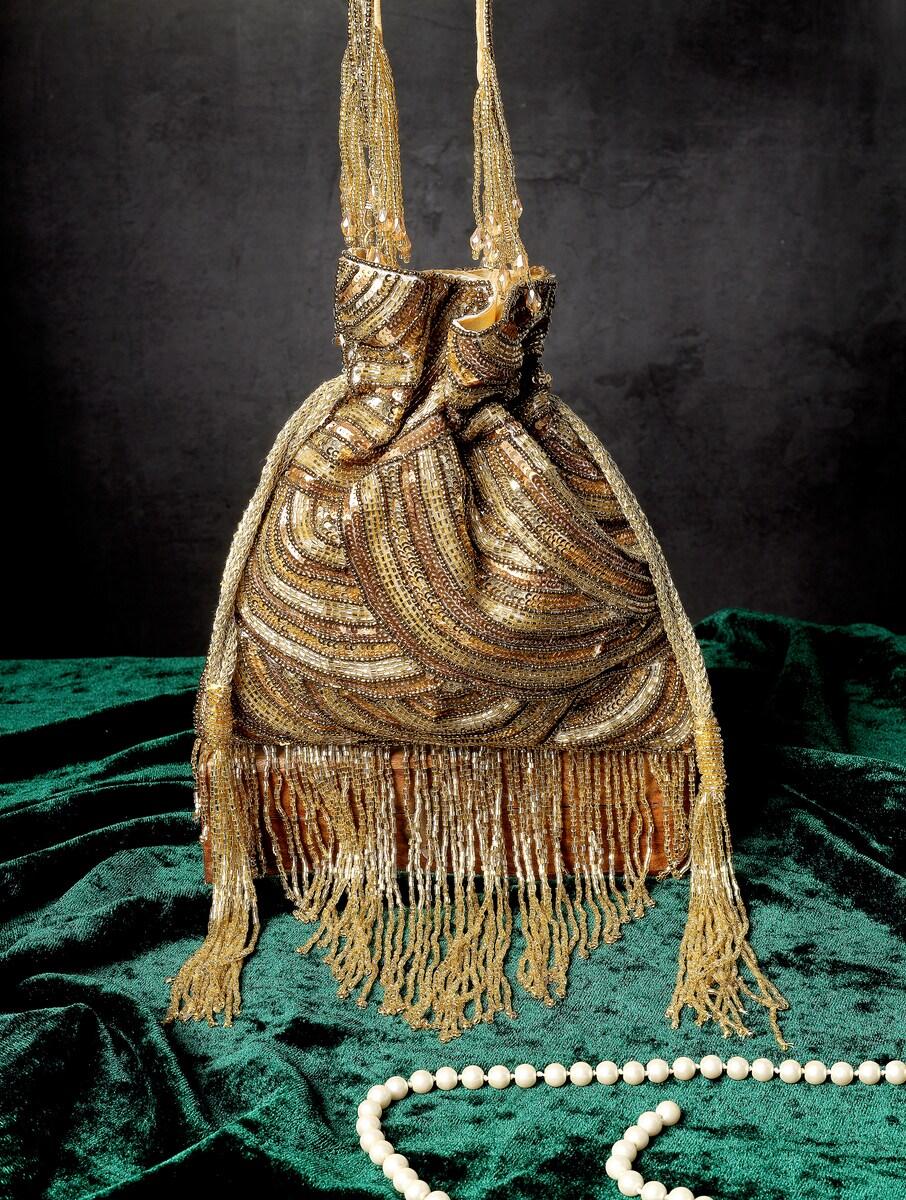 women gold sequins potli