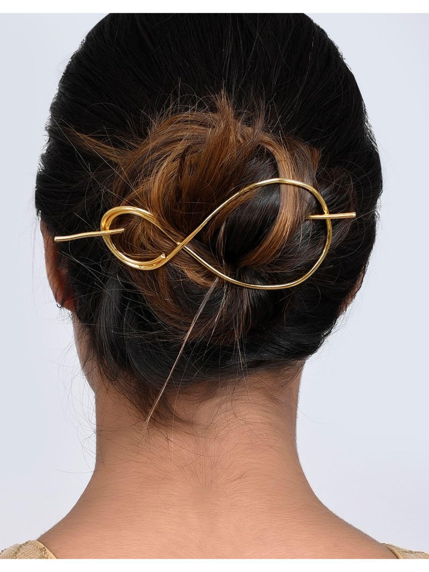 women gold toned embellished hair accessory