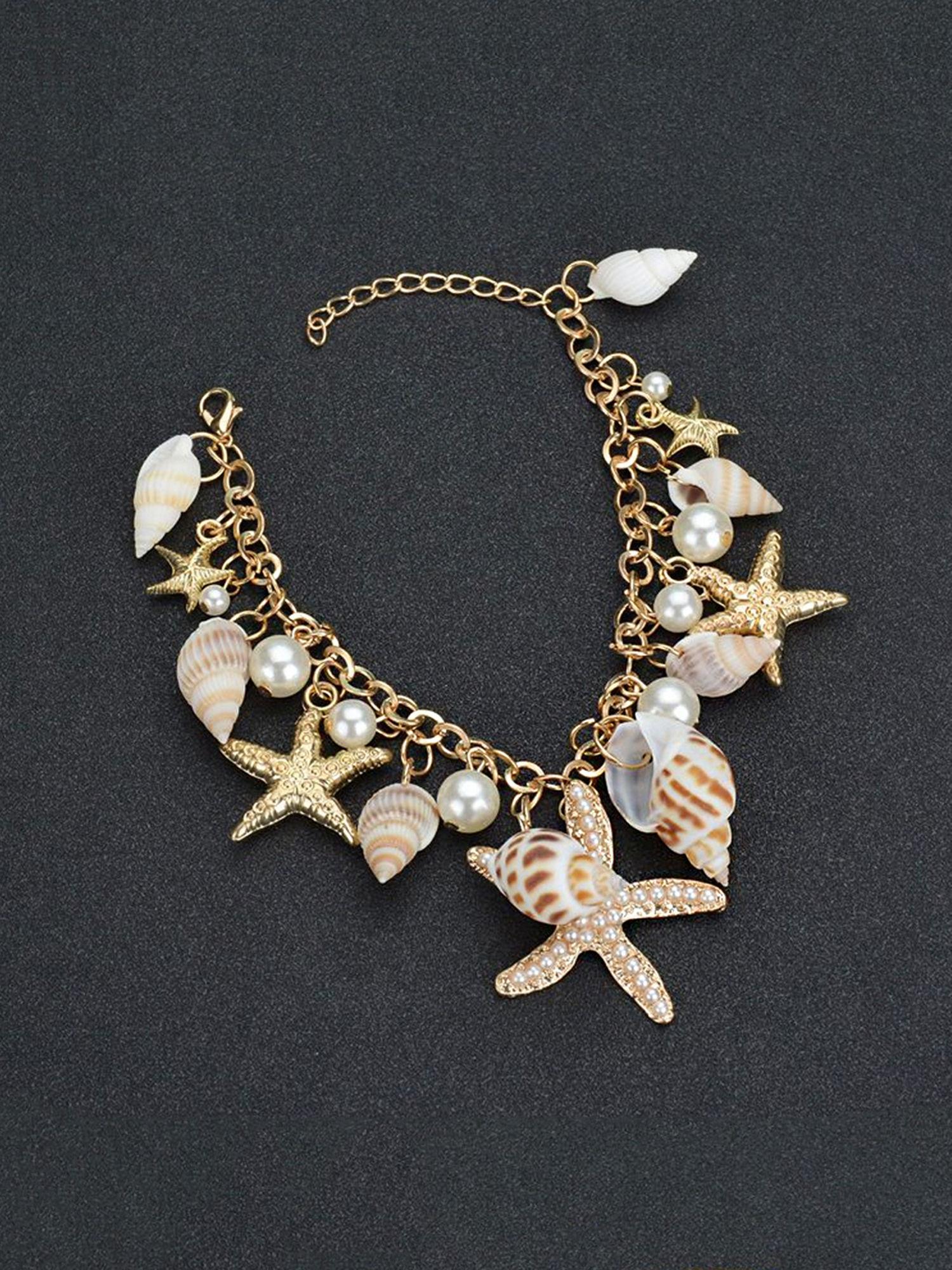 women gold-toned sea shell starfish and pearls hanging charm bracelet
