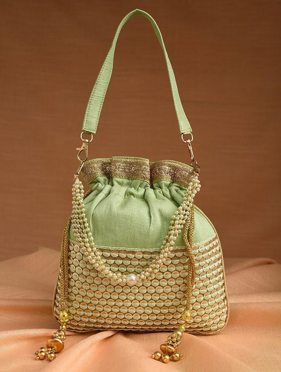 women green silk potli