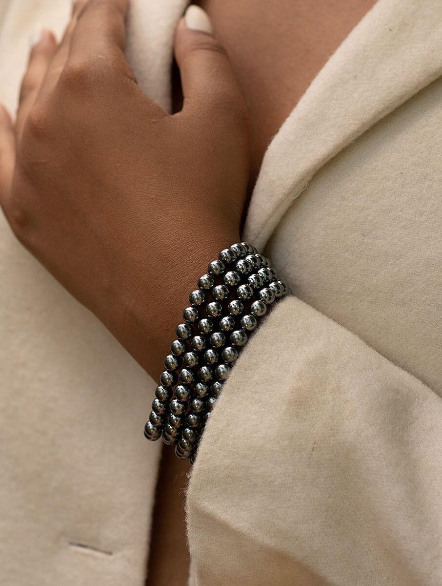 women grey pearls cuffs &amp; bracelet