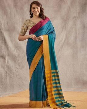 women handloom saree with contrast border & tassels