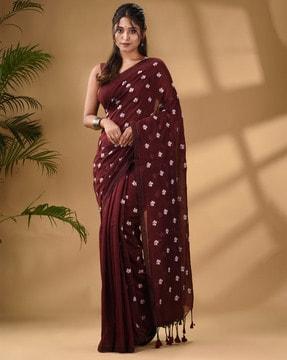 women handwoven saree with floral motifs