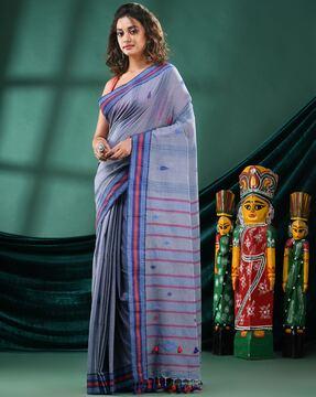 women handwoven saree with tassels