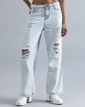 women heavily distressed relaxed jeans