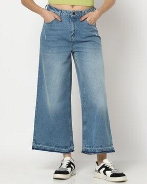 women heavily washed flared jeans