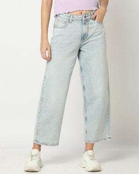women heavily washed relaxed fit jeans