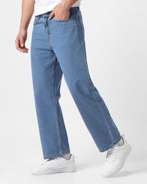 women heavily washed relaxed jeans