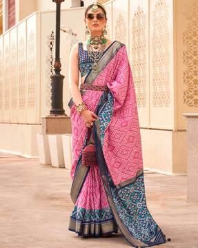 women ikat woven saree with latkans border