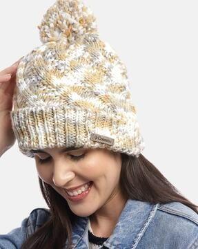 women knitted beanie with pom-pom detail