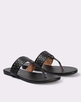 women laser-cut t-strap sandals