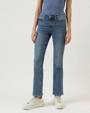 women lightly washed bootcut jeans