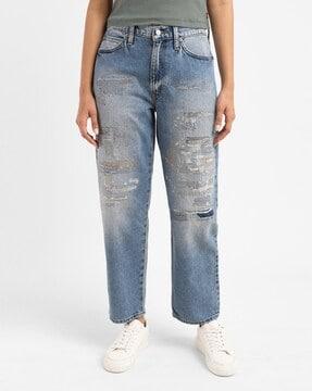 women lightly washed distressed baggy fit jeans