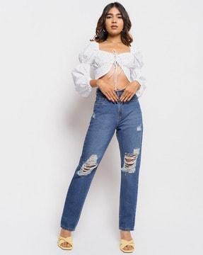 women lightly washed distressed mom fit jeans