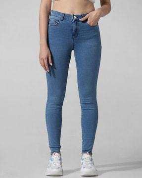 women lightly washed skinny jeans