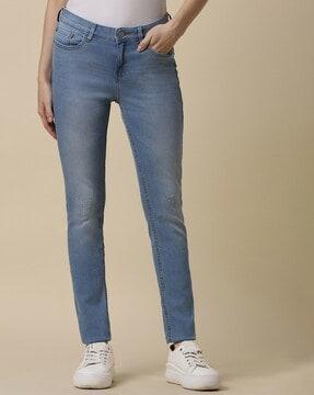 women lightly washed slim fit jeans