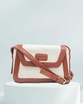 women logo embossed sling bag with adjustable strap