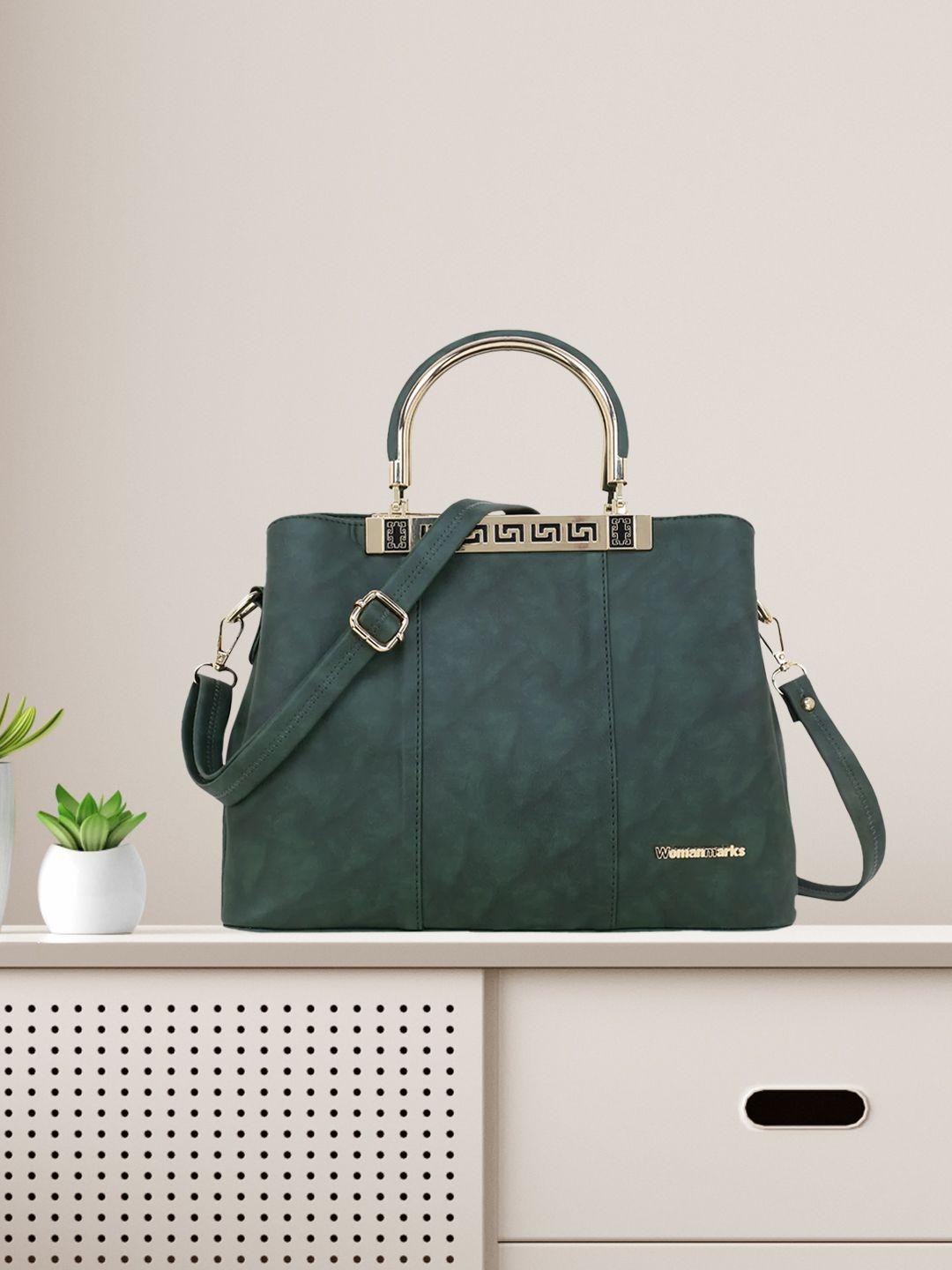 women marks green textured handheld bag