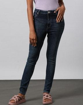 women mid- wash skinny fit jeans