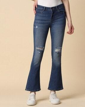 women mid-wash bootcut distressed jeans