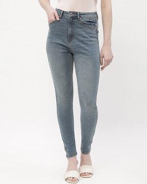 women mid wash skinny jeans