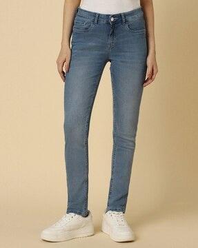 women mid-wash slim fit jeans