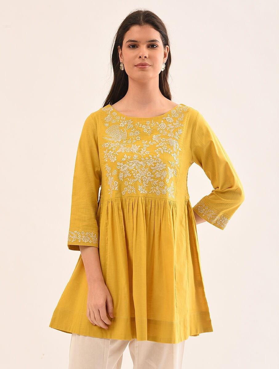women mustard yellow cotton embroidered round neck regular fit tunics