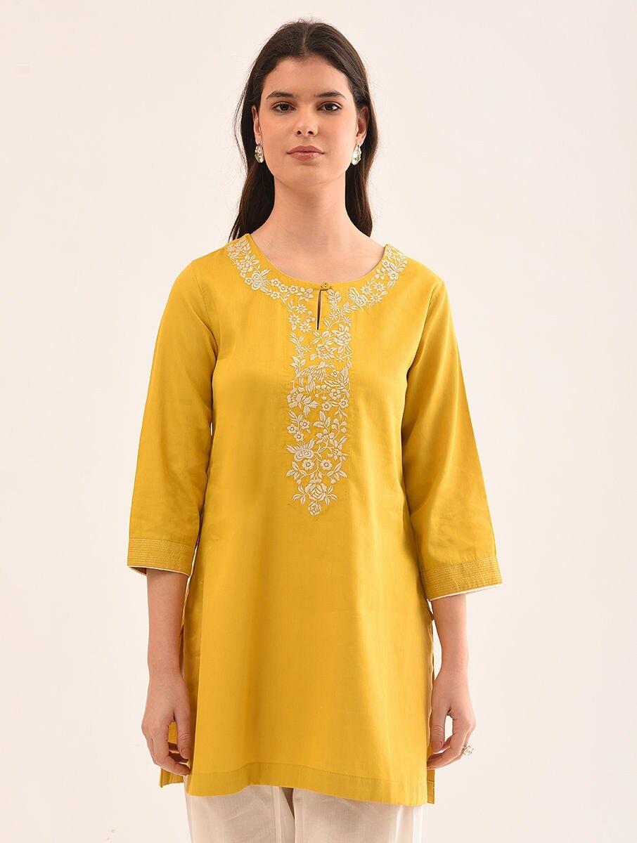 women mustard yellow cotton embroidered round neck regular fit tunics