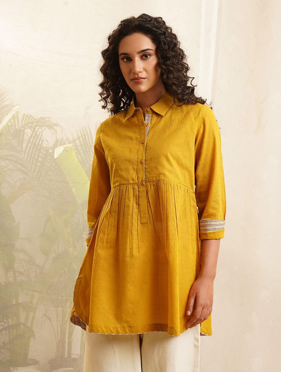 women mustard yellow cotton self design collar neck regular fit tunics