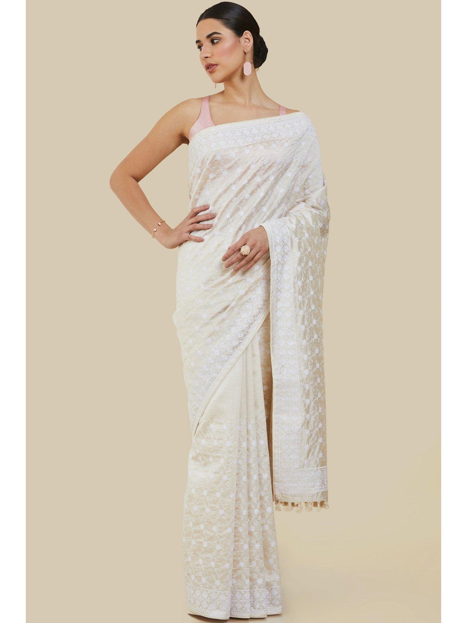 women off white silk embroidered saree with unstitched blouse