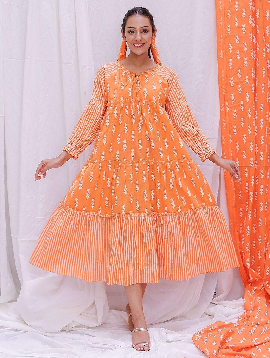 women orange cotton floral round neck flared dresses