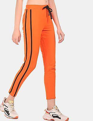 women orange mid rise solid track pants