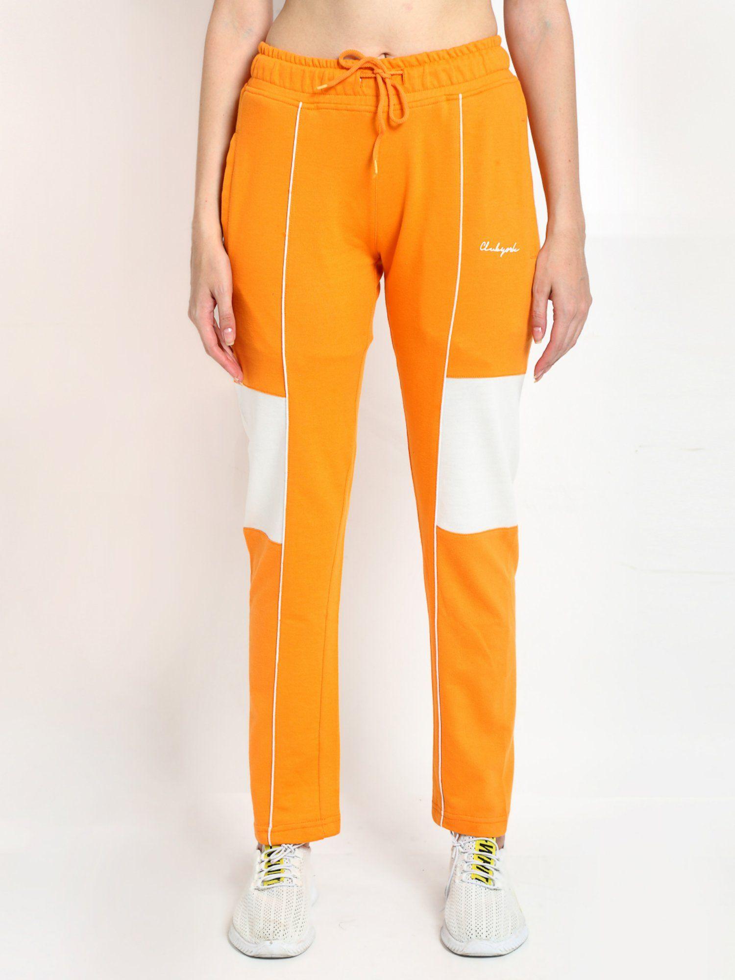 women orange white colour blocked straight- fit track pants