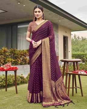 women paisley woven saree with tassels