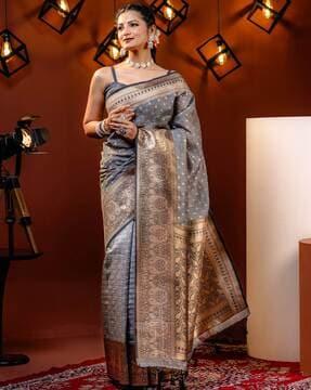 women paisley woven saree with tassels