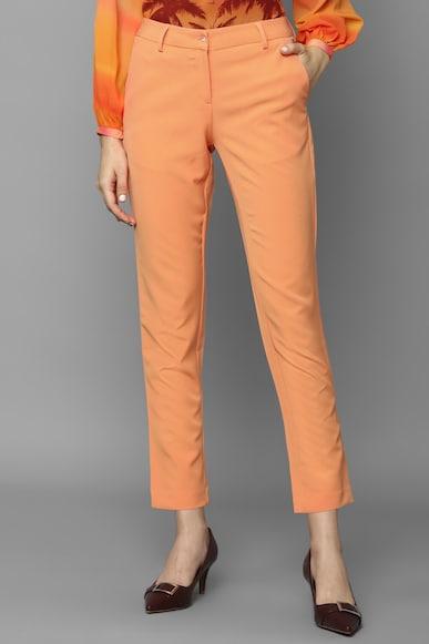 women peach regular fit solid casual trousers
