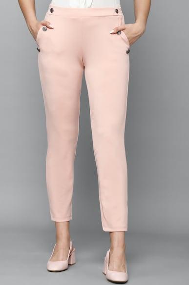 women peach slim fit solid casual trousers