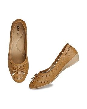 women perforated slip-on shoes