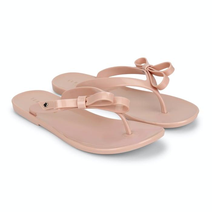 women pink bow flip-flops