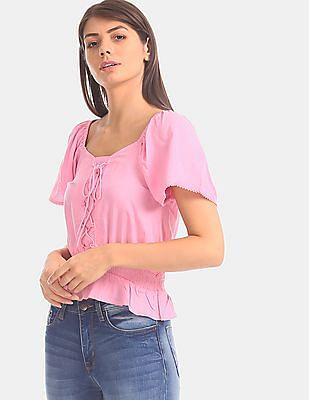 women pink elasticized neck smocked waist top