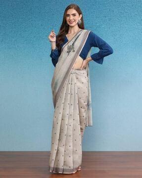 women polka-dot print saree with contrast border